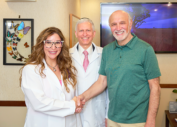 happy patient with the team