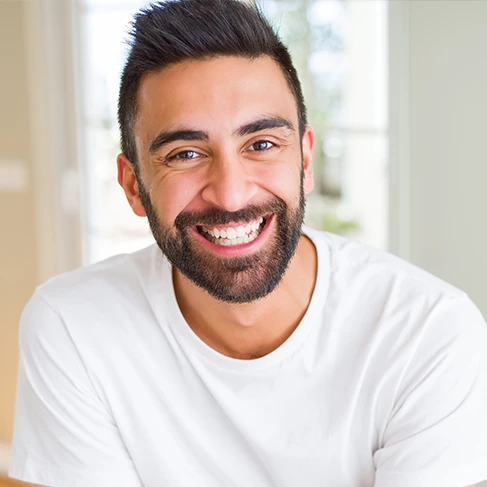 a man after teeth whitening treatment at Brookline Smile Artists