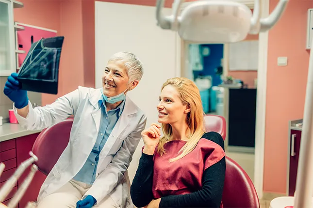 doctor and patient reading x-ray